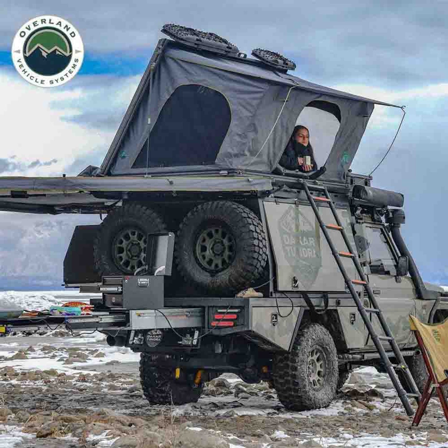 OVS Sidewinder tent mounted on Jeep with open door and full gear setup