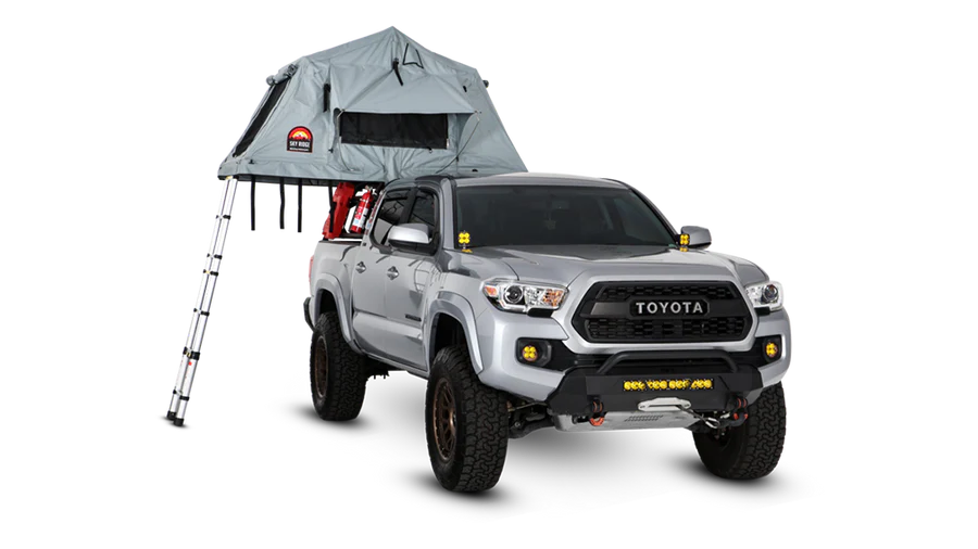 Wide shot of Body Armor 4x4 Sky Ridge Pike Rooftop Tent mounted on SUV, highlighting adventure-ready setup for overlanding and rooftop camping