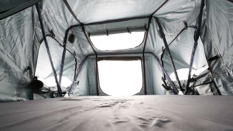 Interior shot of Body Armor 4x4 Sky Ridge Pike Rooftop Tent showing mesh windows, skylight, and spacious 2-person sleeping area