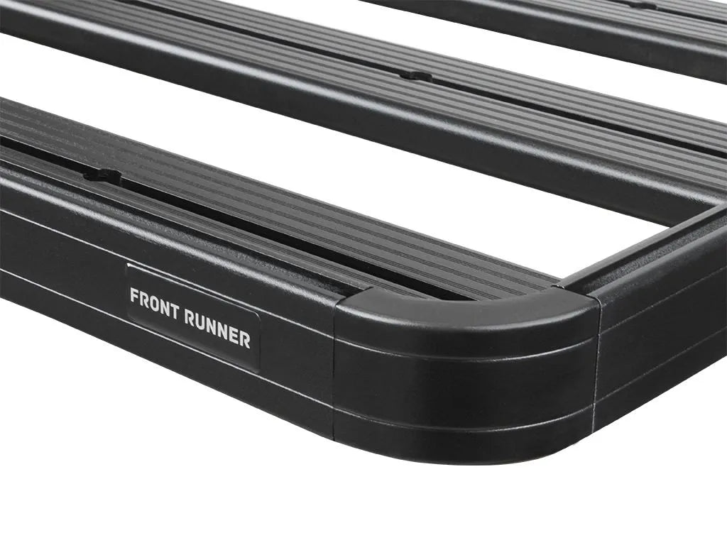 Close-up of FrontRunner Slimline 2 Full Truck Bed Rack Kit corner with branded plate, showcasing rugged design for Ford pickup trucks