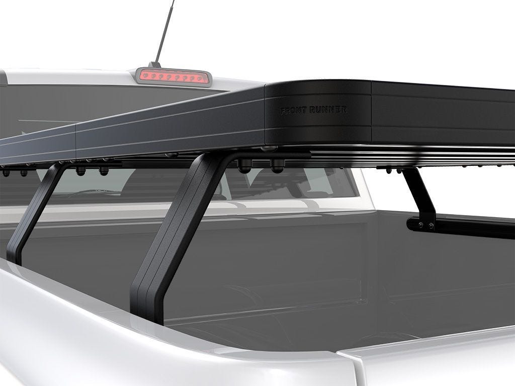 Rear side view of FrontRunner Slimline 2 Full Truck Bed Rack Kit installed on Chevrolet/GMC pickup, highlighting sleek aerodynamic rack profile