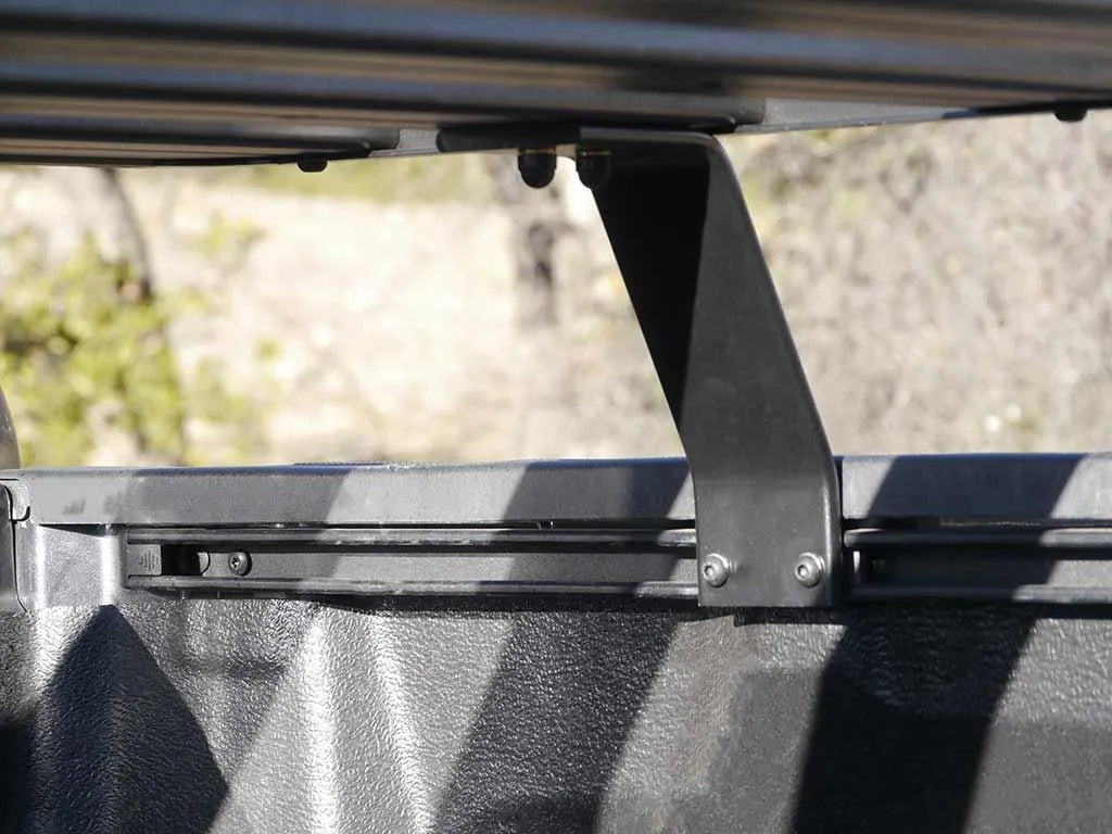 Rear close-up of FrontRunner Slimline 2 Full Truck Bed Rack Kit mounted on Ram pickup truck, showing rooftop tent-ready modular rack system