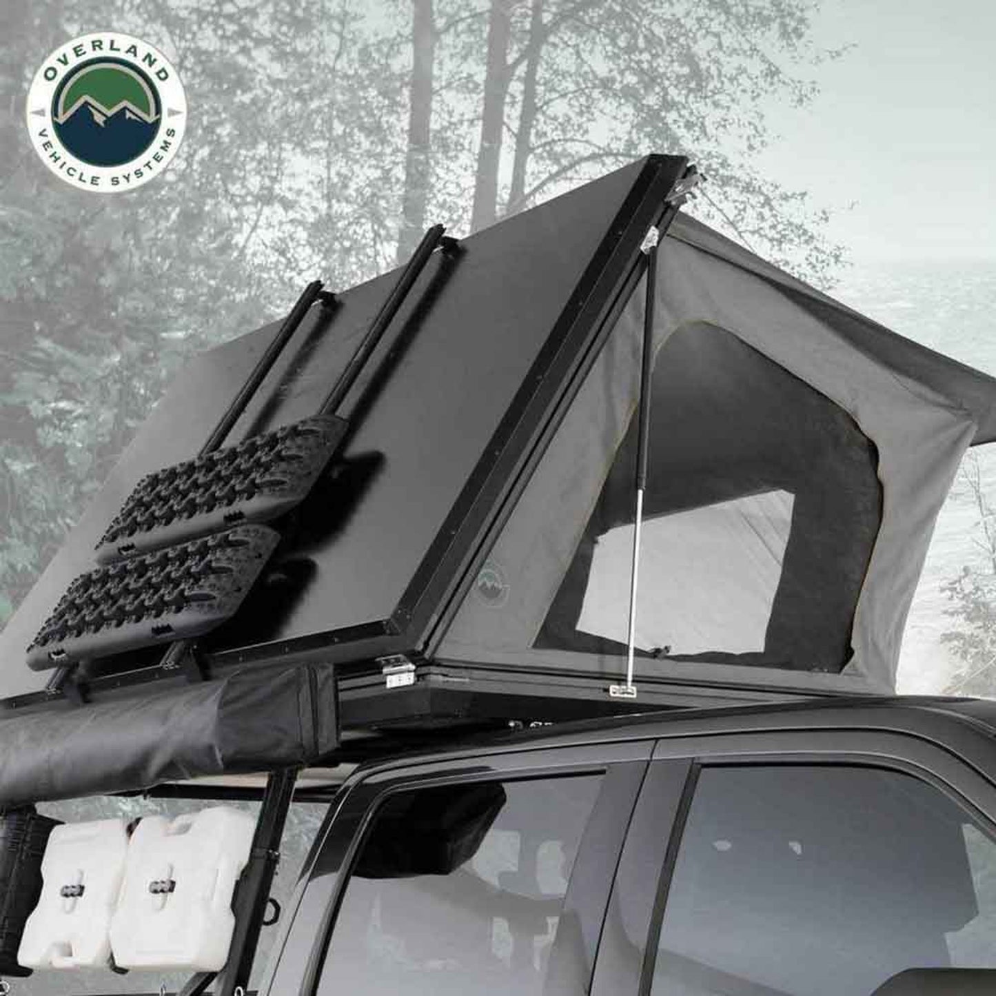 OVS Sidewinder rooftop tent opened on vehicle parked in snowy forest
