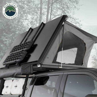 OVS Sidewinder rooftop tent opened on vehicle parked in snowy forest