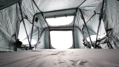 Interior shot of Body Armor 4x4 Sky Ridge Pike Rooftop Tent showing mesh windows, skylight, and spacious 2-person sleeping area