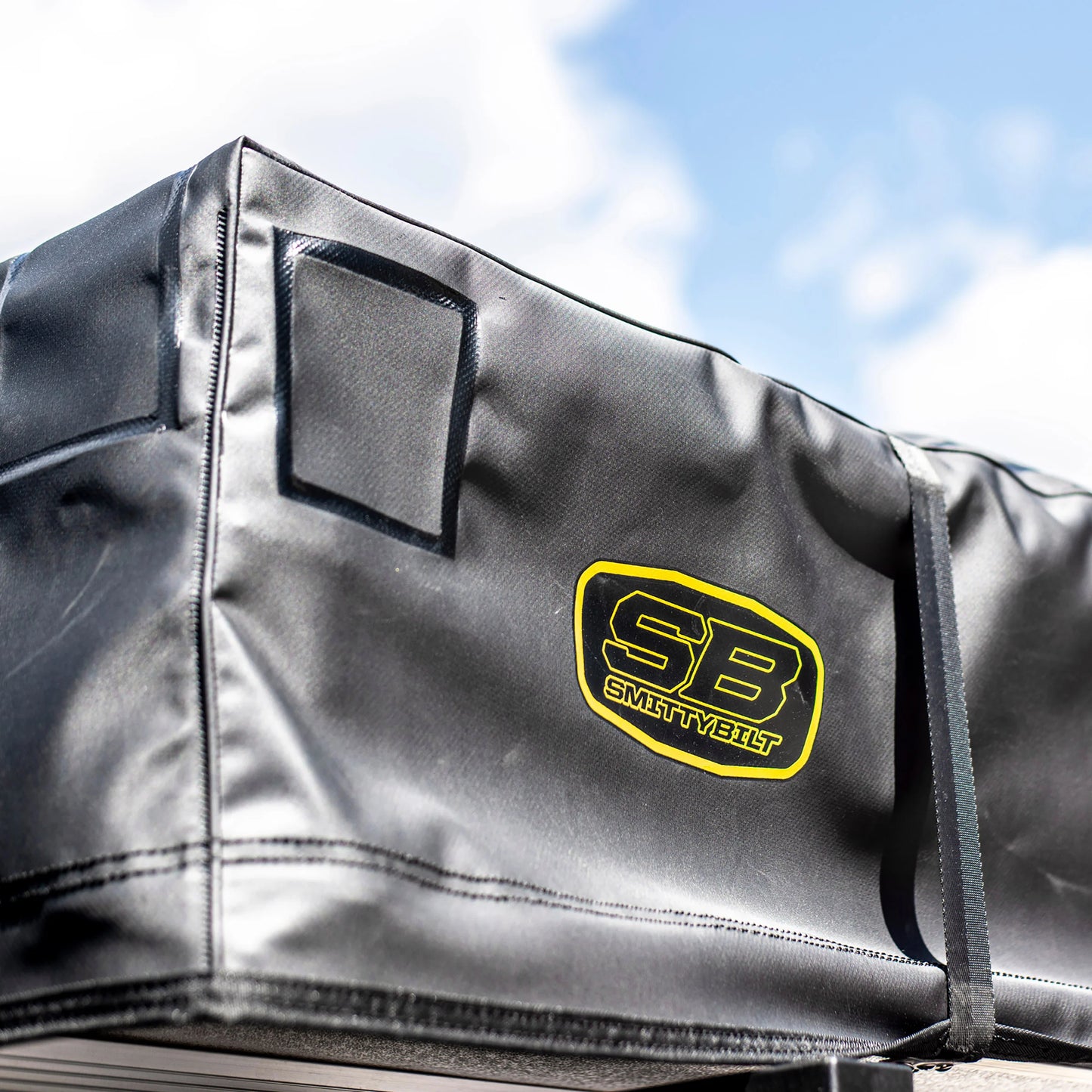 Smittybilt Gen2 Overlander Tent protective cover with logo close-up, highlighting durable materials and branding