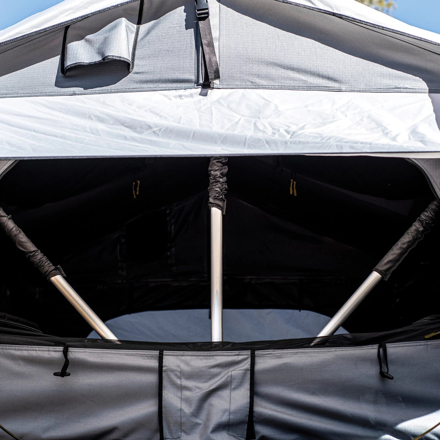 Smittybilt Gen2 Overlander Tent interior view showing mesh windows and skylight, designed for ventilation and comfort during overlanding trips