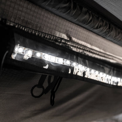 Close-up of Smittybilt Gen2 Overlander Tent’s built-in LED light strip illuminating tent interior