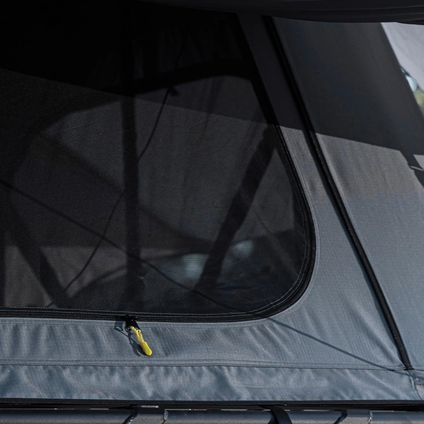 Close-up of Smittybilt Gen2 Overlander Tent rainfly material and stitching, highlighting durable, weatherproof construction