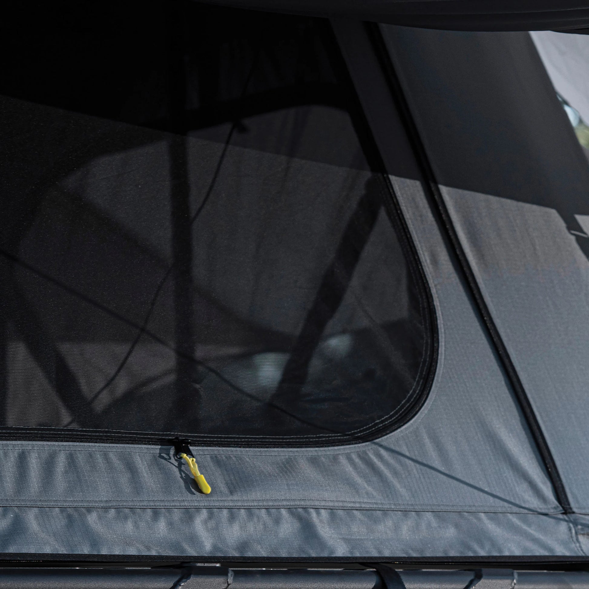Close-up of Smittybilt Gen2 Overlander Tent rainfly material and stitching, highlighting durable, weatherproof construction