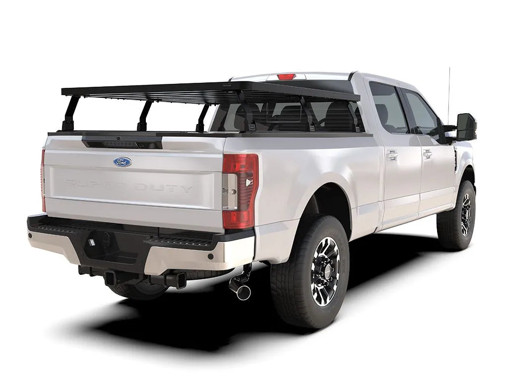Side rear view of Ford pickup equipped with FrontRunner Slimline 2 Full Truck Bed Rack Kit, showing rooftop tent-ready modular rack for overlanding