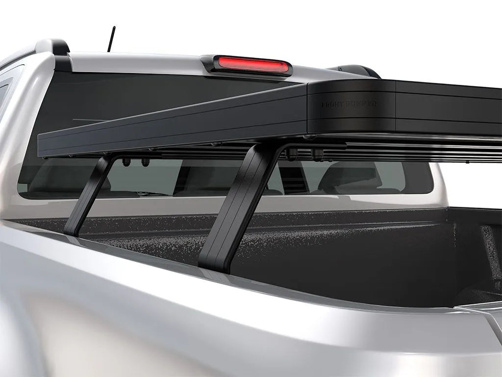 Rear angle close-up of FrontRunner Slimline 2 Full Truck Bed Rack Kit mounted on Nissan pickup, rooftop tent-ready modular rack system