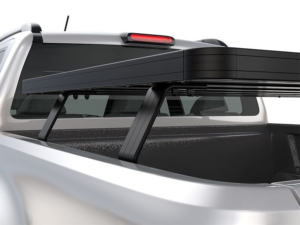 Rear corner close-up of FrontRunner Slimline 2 Full Truck Bed Rack Kit mounted on Toyota pickup, highlighting robust modular rack system for overlanding
