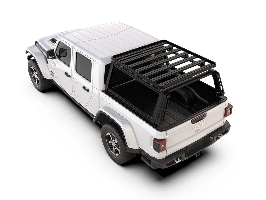Jeep Gladiator (2019–current) equipped with FrontRunner Pro Bed Rack Kit and Slimline II Roof Rack, side rear angle showcasing full overlanding rack setup